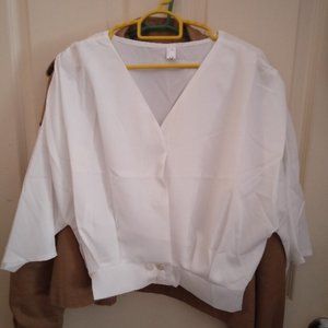 White collared white shirt with waist buckle and women's shirt
